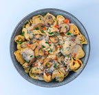 Bio Tortellini in cremiger Champignonsoße